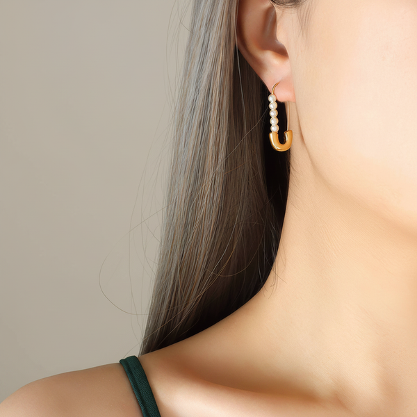 Pearl Hoop Earrings on Beige Background